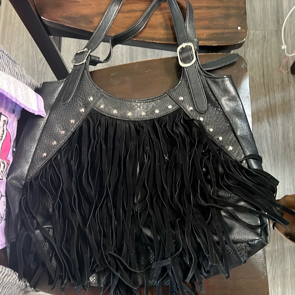 Large black bag with fringe.